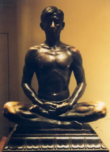 Bronze statue of man in half-lotus Bronze statue of man in half-lotus